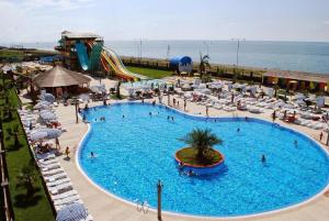 an overhead view of a large swimming pool at a resort at 33 Luxury RA MA DA in Batumi