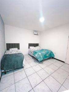 Katil atau katil-katil dalam bilik di Casa em Maceió Praia Pontal da Barra +7 gambar