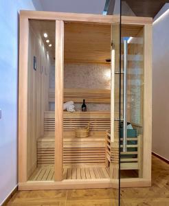a sauna in a room with a glass door at La Depèndance Luxury Rooms in Francavilla al Mare