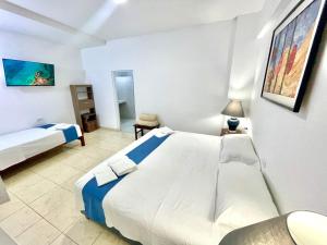 Postel nebo postele na pokoji v ubytování Casa Pacasmayo