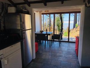 a kitchen with a table and a dining room at Bodega Linda in Puntagorda
