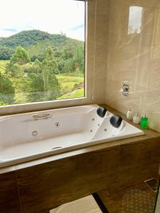 Salle de bains dans l'établissement Pousada Gostinho de Sítio