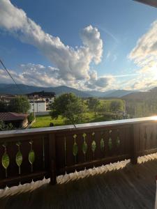 a balcony with a view of the mountains at Pension Haus Georg in Westendorf