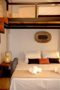 a bed in a room with two bunk beds at Eva's paradise Syros in Ermoupoli