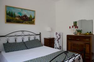 Postel nebo postele na pokoji v ubytování Villa Aripè