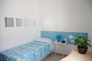 Postel nebo postele na pokoji v ubytování Villa Aripè + 33 fotografií