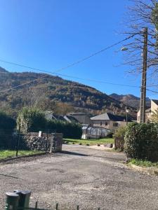 a house with a mountain in the background at Arriu 35 in Bielle +7 photos