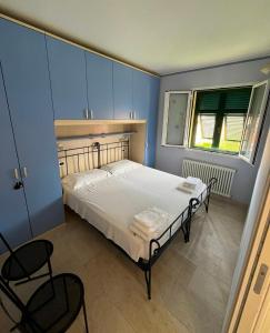 Ένα ή περισσότερα κρεβάτια σε δωμάτιο στο La CASA GIALLA
