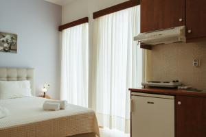 Posteľ alebo postele v izbe v ubytovaní Hotel Livikon + 6 fotografií