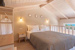 A bed or beds in a room at Oskars Studios & Apartments