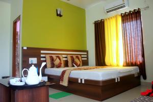 Postel nebo postele na pokoji v ubytování Blooming Star Guest House