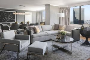 a living room with a couch and a table at The Ritz-Carlton Atlanta in Atlanta