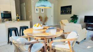 a living room with a table with a bowl of fruit on it at Het Nonnennest in Vught
