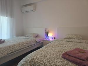 Postel nebo postele na pokoji v ubytování Sunny Rooms