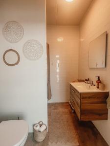 a bathroom with a sink and a toilet at RetreatBoat Ibiza in Lith
