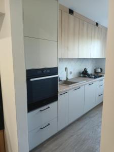 Η κουζίνα ή μικρή κουζίνα στο Apartament 2 pokoje