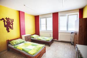 Postel nebo postele na pokoji v ubytování Penzion První Liga