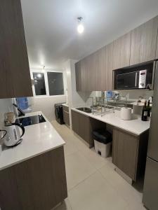 Η κουζίνα ή μικρή κουζίνα στο Departamento para 7 personas Con con +5 φωτογραφίες