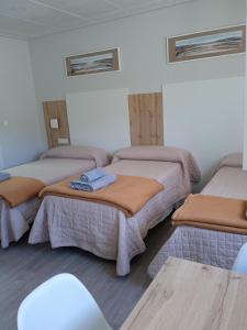Ένα ή περισσότερα κρεβάτια σε δωμάτιο στο Hostal La Morenica