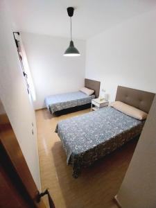 a room with two beds and a couch in it at S&H La Malcriada in San Juan de los Terreros +29 photos