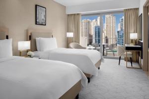 Uma cama ou camas num quarto em JW Marriott Hotel Marina