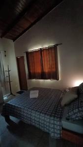Cama ou camas em um quarto em Casa Conforto Piri