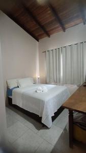 Cama ou camas em um quarto em Casa Conforto Piri