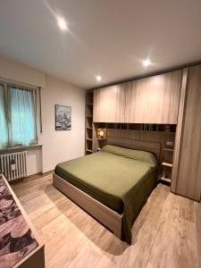 Postel nebo postele na pokoji v ubytování Casa di Chiara Andalo Centro
