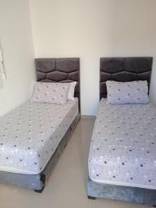 Postel nebo postele na pokoji v ubytování La perle bleue