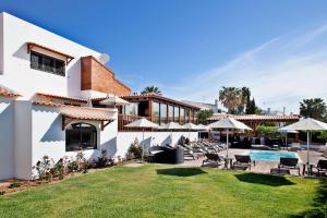 a villa with a swimming pool and a resort at Sao Rafael Holidays in Albufeira