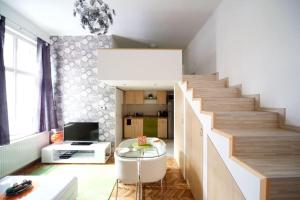 a living room with a staircase with a glass table at Pedestrian Area, City Center in Budapest