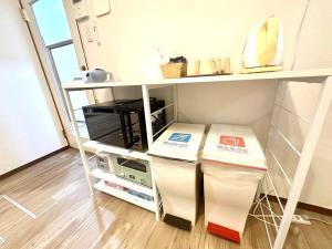 Köök või kööginurk majutusasutuses 名古屋市北区楠民泊