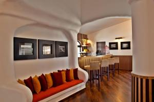 a living room with a couch and a bar at Sao Rafael Holidays in Albufeira