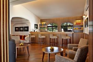 a living room with chairs and a table at Sao Rafael Holidays in Albufeira
