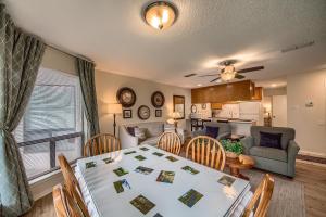 a dining room and living room with a table and chairs at CRC 317 Timeless Tranquility in New Braunfels