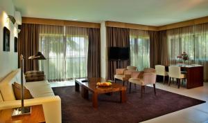 a living room with a couch and a table at Sao Rafael Holidays in Albufeira