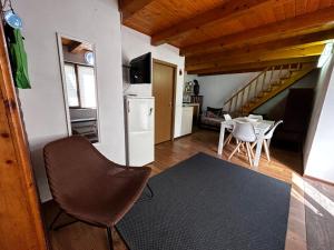 a living room with a kitchen and a dining room at The Great Escape in Dejani