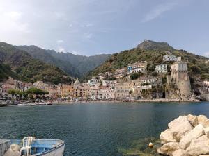a town on the shore of a body of water at Victor's Room in Cetara