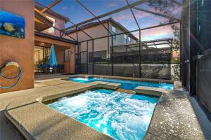 a swimming pool in the middle of a house at Experience Solterra: Pool, Spa, Game Room & Lazy River in Davenport