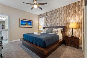 a bedroom with a bed and a ceiling fan at Experience Solterra: Pool, Spa, Game Room & Lazy River in Davenport