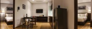 Giường trong phòng chung tại Di lusso Boutique Hotel Riverside Danang