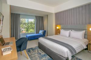 Letto o letti in una camera di Oakwood Merdeka Bandung