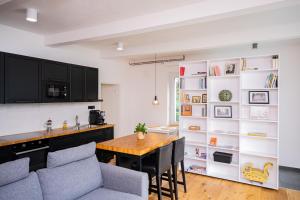 a kitchen and dining room with a table and chairs at Zlinapartman in Zlín