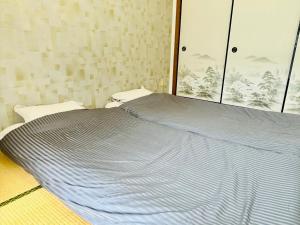 Voodi või voodid majutusasutuse Maison Myoken toas