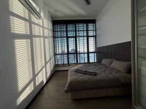 Letto o letti in una camera di ANNA AR ANTARA RESIDENCE LAKE VIEW, Putrajaya