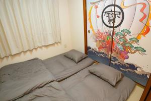 Cama ou camas em um quarto em 2階 小岩駅徒歩15分 収容4人 成田羽田からバス直通