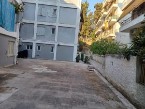 an empty street in front of a building at fotinoula1975 in Ágios Rókkos