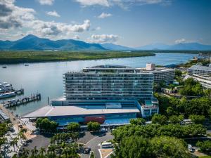 a view of a large hotel on the water at Belle Escapes 24 Harbour Lights Water View Apartment in Cairns