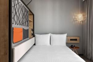 Stay KooooK Leipzig City - Online Check In客房内的一张或多张床位