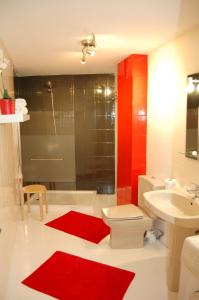 a bathroom with a toilet and a sink and a shower at O Sole Mio in Albir